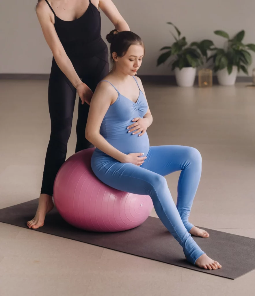 pregnant woman with a trainer during fitness class 2023 11 27 04 55 14 utc scaled e1720089665773